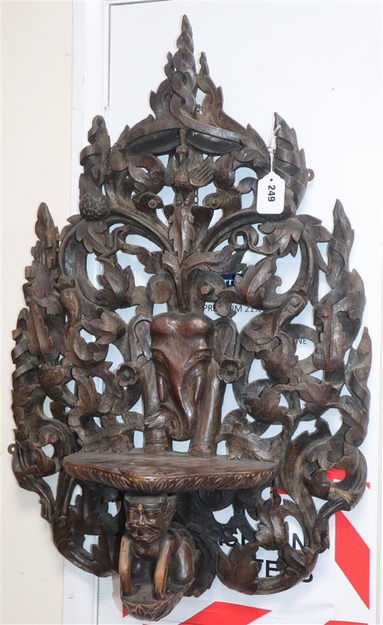 A Burmese or Indian teak wall bracket length 80cm